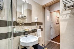 a bathroom with a sink and a shower at La Residenza Dell'Angelo in Rome