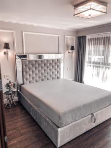 Кровать или кровати в номере Private Luxury Apartment In Nida Centre "Vilnelės Apartamentai"