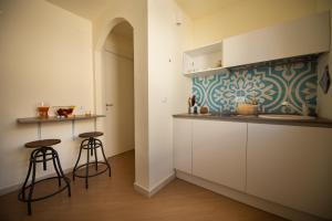Kuchyň nebo kuchyňský kout v ubytování San Vito Accommodations