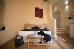Postel nebo postele na pokoji v ubytování San Vito Accommodations