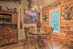 a dining room with a table and chairs at Eclectic Cabin with Hot Tub 1 Mi to Ober Gatlinburg in Gatlinburg