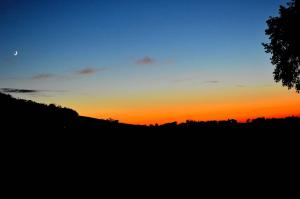 The sunrise or sunset as seen from a vidéki vendégházakat or nearby