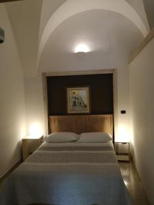 Säng eller sängar i ett rum på B&B Corte San Giuseppe