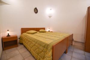 Łóżko lub łóżka w pokoju w obiekcie Agriturismo il Ciliegeto