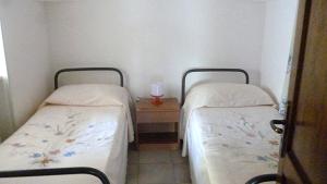 Łóżko lub łóżka w pokoju w obiekcie Agriturismo il Ciliegeto