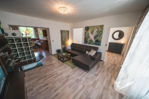 a living room with a couch and a table at Dolomitenmannapartments in Lienz