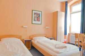 Postel nebo postele na pokoji v ubytování Happy Hotel Berlin