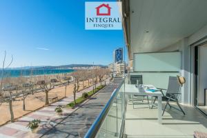 a conference room with a table and a screen on a building at Palamós BeachFront Apartment in Palamós