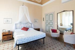 Posteľ alebo postele v izbe v ubytovaní Attico Luce B&B