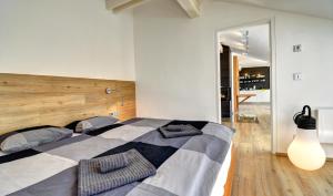 Posteľ alebo postele v izbe v ubytovaní Apartmány Tadeáš