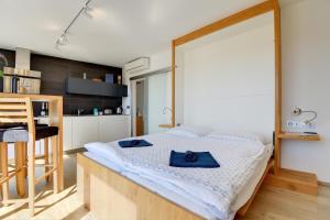 Posteľ alebo postele v izbe v ubytovaní Apartmány Tadeáš