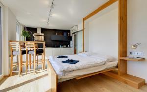 Posteľ alebo postele v izbe v ubytovaní Apartmány Tadeáš