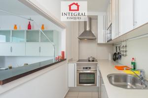 A kitchen or kitchenette at Palamós BeachFront Apartment