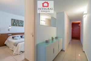A bed or beds in a room at Palamós BeachFront Apartment