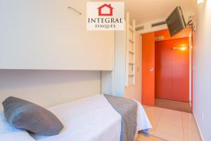 A bed or beds in a room at Palamós BeachFront Apartment