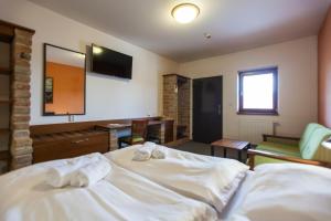 Rúm í herbergi á Hotel Vinař - Bed & Breakfast