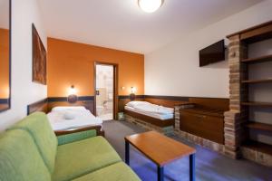 Rúm í herbergi á Hotel Vinař - Bed & Breakfast