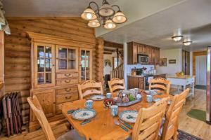a kitchen and dining room with a wooden table and chairs at Garden City Escape with View Less Than 2 Miles to Bear Lake in Garden City