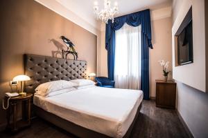 Letto o letti in una camera di Hotel Ristorante Ala d'Oro