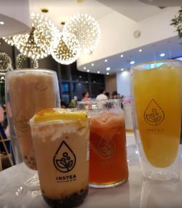 three different types of drinks sitting on a table at Tropicana 218 Georgetown #31 無敵海景 一房一廳式Max.6pax in George Town