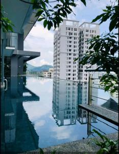 a large pool of water with buildings in the background at Tropicana 218 Georgetown #31 無敵海景 一房一廳式Max.6pax in George Town +36 photos