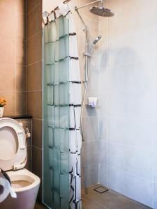 a bathroom with a shower and a toilet at Tropicana 218 Georgetown #31 無敵海景 一房一廳式Max.6pax in George Town