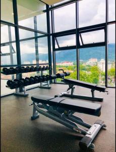 a gym with a bench and weights in a building at Tropicana 218 Georgetown #31 無敵海景 一房一廳式Max.6pax in George Town