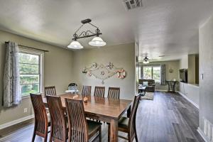 a dining room with a wooden table and chairs at Spacious and Modern Family Duplex in Galveston! in Galveston