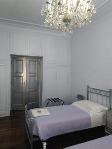 Postel nebo postele na pokoji v ubytování Around The Corner Colosseo B&B