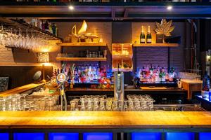 a bar with a lot of glasses on the counter at Theaterhotel Venlo in Venlo