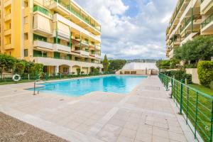 a swimming pool in front of a building at Aqua Vista Casa at Xylokastro in Xylokastron