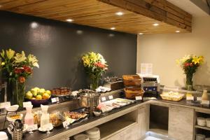 a buffet line with many different types of food at Easter Island Ecolodge in Hanga Roa