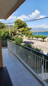 a balcony with a view of the ocean at Nafpaktos Beach House in Nafpaktos