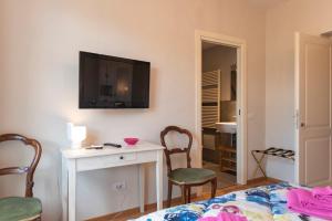 TV a/nebo společenská místnost v ubytování IN LUCUS Guest House