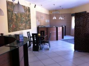 Kuchyň nebo kuchyňský kout v ubytování Hotel Giardino