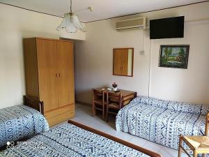 Postel nebo postele na pokoji v ubytování Hotel Eliseo