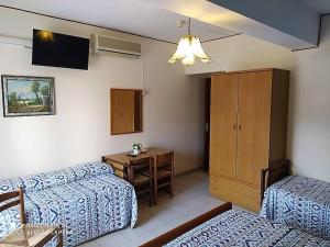 Postel nebo postele na pokoji v ubytování Hotel Eliseo