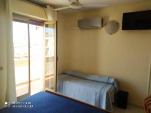 Postel nebo postele na pokoji v ubytování Hotel Eliseo