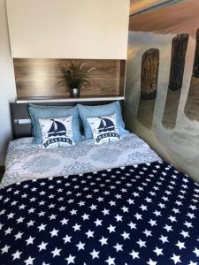 Posteľ alebo postele v izbe v ubytovaní Apartament Baltik Star