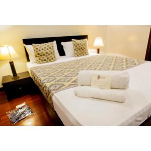 Voodi või voodid majutusasutuse Esquire Hotels & Apartments toas