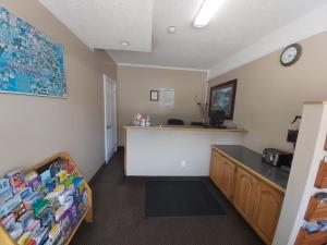 a waiting room with a counter and a desk at Arnprior Motor Inn in Arnprior
