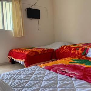 Krevet ili kreveti u jedinici u okviru objekta Hotel Maxim