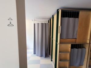 A bed or beds in a room at Green Marmot Capsule Hotel Zürich