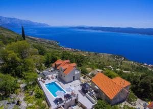 an aerial view of a house with a swimming pool at XXL Villa Vista - Heated Pool in Lokva Rogoznica