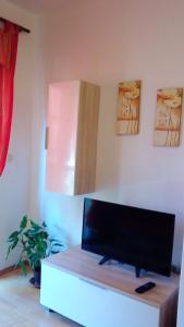 a living room with a flat screen tv on a table at Charming Apartment in Zadar, Sea View in Zadar