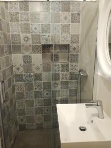 a bathroom with a sink and a shower at Apartment Mila Krk in Krk