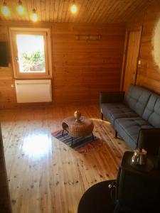 Posezení v ubytování Chalet Le Cactus avec sauna privatif