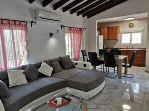 a living room with a couch and a table at Villa Romeo in Calpe
