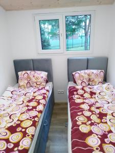 Postel nebo postele na pokoji v ubytování Domek Kormoran