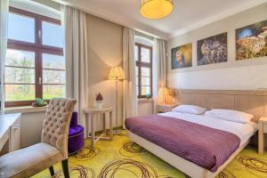 Posteľ alebo postele v izbe v ubytovaní Hanza Pałac Wellness & SPA